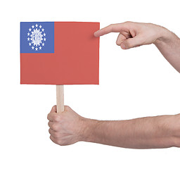 Image showing Hand holding small card - Flag of Myanmar