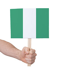 Image showing Hand holding small card - Flag of Nigeria