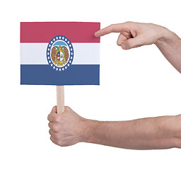 Image showing Hand holding small card - Flag of Missouri