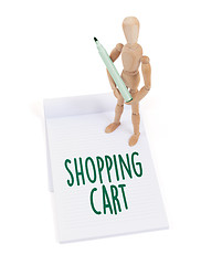 Image showing Wooden mannequin writing - Shopping cart