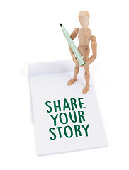 Image showing Wooden mannequin writing - Share your story