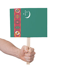 Image showing Hand holding small card - Flag of Turkmenistan