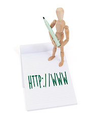 Image showing Wooden mannequin writing - http www