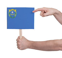 Image showing Hand holding small card - Flag of Nevada
