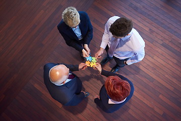 Image showing assembling jigsaw puzzle