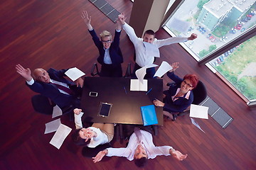 Image showing top view of business people group throwing dociments in air