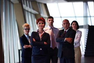 Image showing diverse business people group with redhair  woman in front