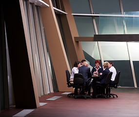 Image showing business people group on meeting at modern bright office