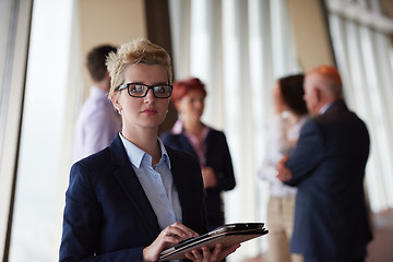 Image showing diverse business people group with blonde  woman in front