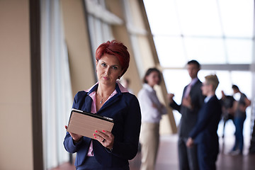 Image showing business woman  at office with tablet  in front  as team leader