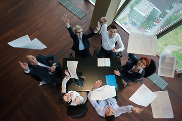 Image showing top view of business people group throwing dociments in air