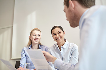 Image showing group of smiling businesspeople meeting in office