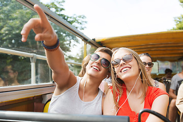 Image showing happy teenage couple traveling by tour bus