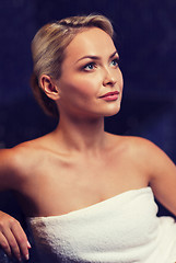 Image showing beautiful young woman sitting in bath towel