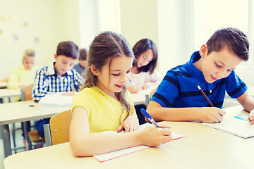 Image showing group of school kids writing test in classroom