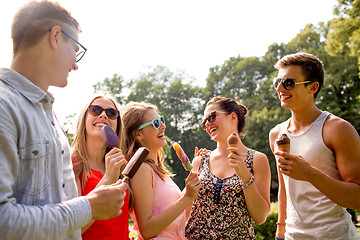 Image showing group of smiling friends with ice cream outdoors