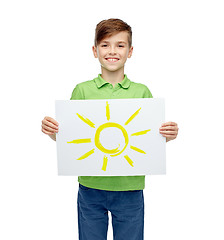 Image showing happy boy holding drawing or picture of sun