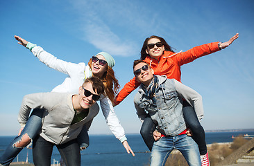 Image showing happy friends in shades having fun outdoors