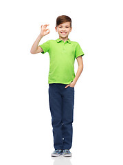 Image showing happy boy in white t-shirt showing ok hand sign