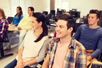 Image showing group of smiling students in lecture hall