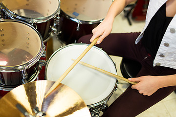 Image showing close up of musician playing cymbals on drum kit