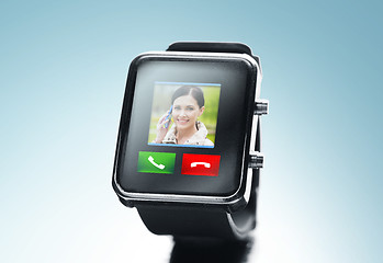 Image showing close up of black smart watch with video call icon