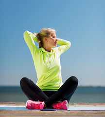 Image showing woman doing yoga outdoors