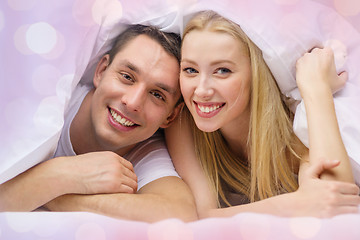 Image showing happy couple sleeping in bed