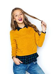 Image showing happy young woman or teen girl in casual clothes