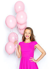 Image showing happy young woman or teen girl in pink dress