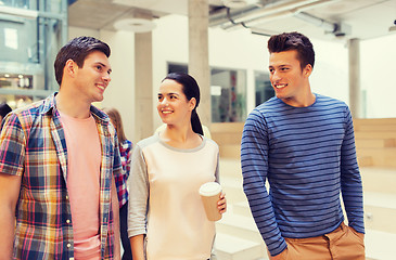 Image showing group of smiling students with paper coffee cups