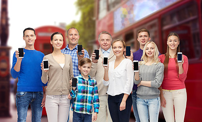 Image showing happy people with smartphones over london city