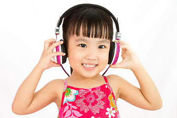 Image showing Chinese little girl on headphones