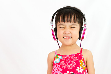 Image showing Chinese little girl on headphones