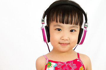 Image showing Chinese little girl on headphones