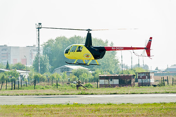 Image showing Piloting of Robinson R44 Raven on airshow