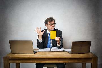 Image showing Business man with yellow card