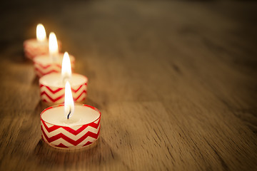 Image showing Romantic candles on wooden table