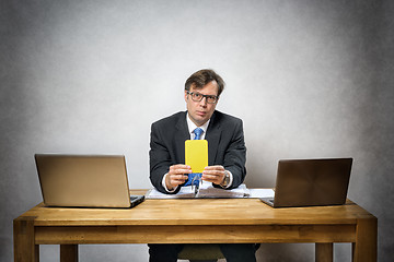 Image showing Business man with yellow card