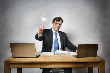 Image showing business man with sparkler