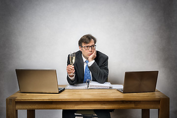 Image showing Lonely business man with champagne glass