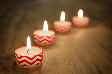 Image showing Romantic candles on wooden table