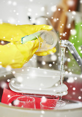 Image showing close up of woman hands washing dishes in kitchen