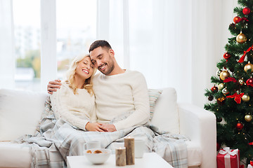 Image showing happy couple at home with christmas tree