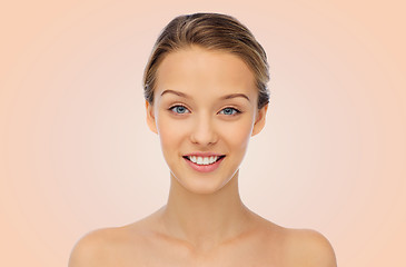 Image showing smiling young woman face and shoulders