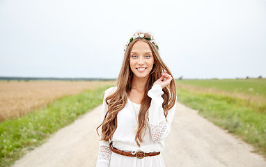 Image showing smiling young hippie woman on cereal field