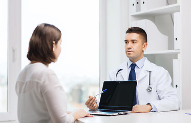 Image showing doctor and young woman meeting at hospital