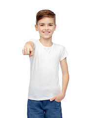 Image showing happy boy in white t-shirt pointing finger to you