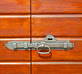 Image showing europe old in  italy  antique close brown door and rusty lock  c