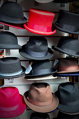 Image showing in london old red hat and black  the  fashion shop